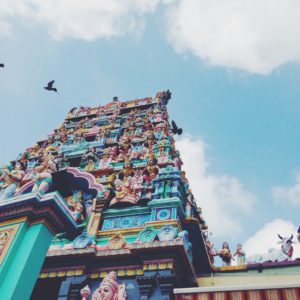 Sri Sri Mariamman Temple in Singapore with flying birds