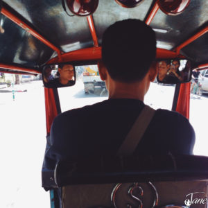 Behind the tuk tuk driver