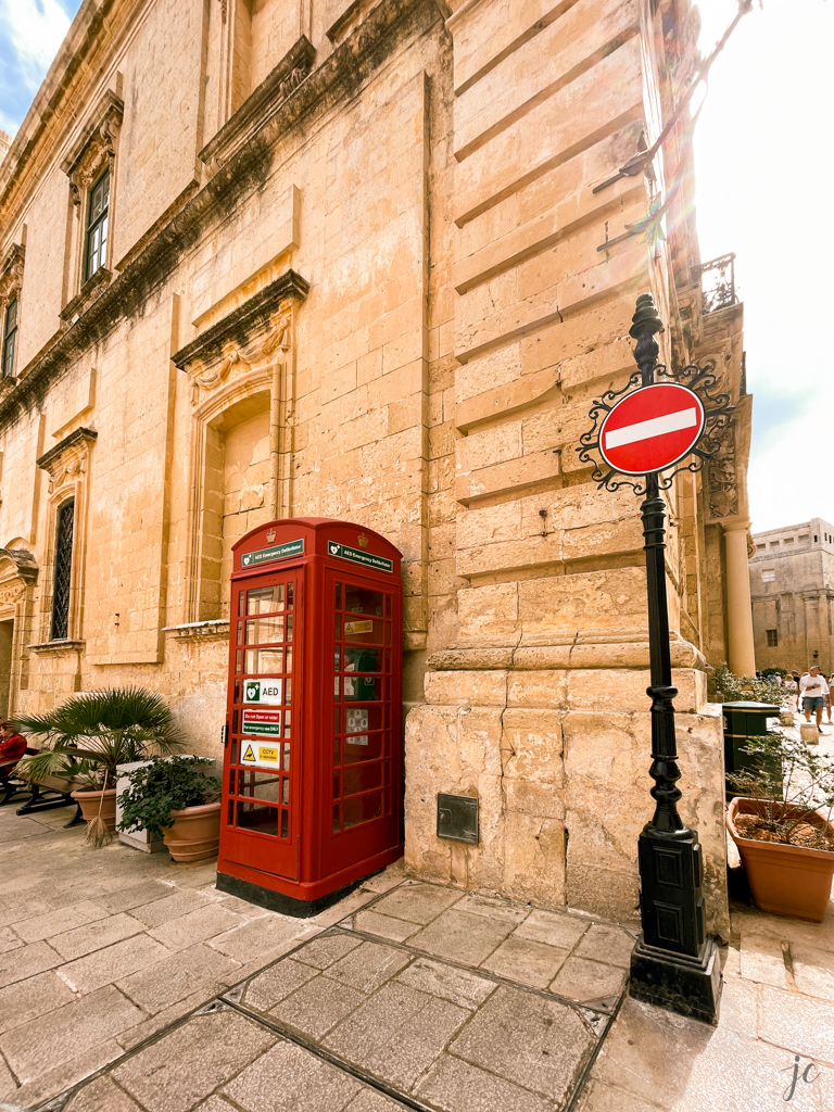 Red telephone booth in Mdina